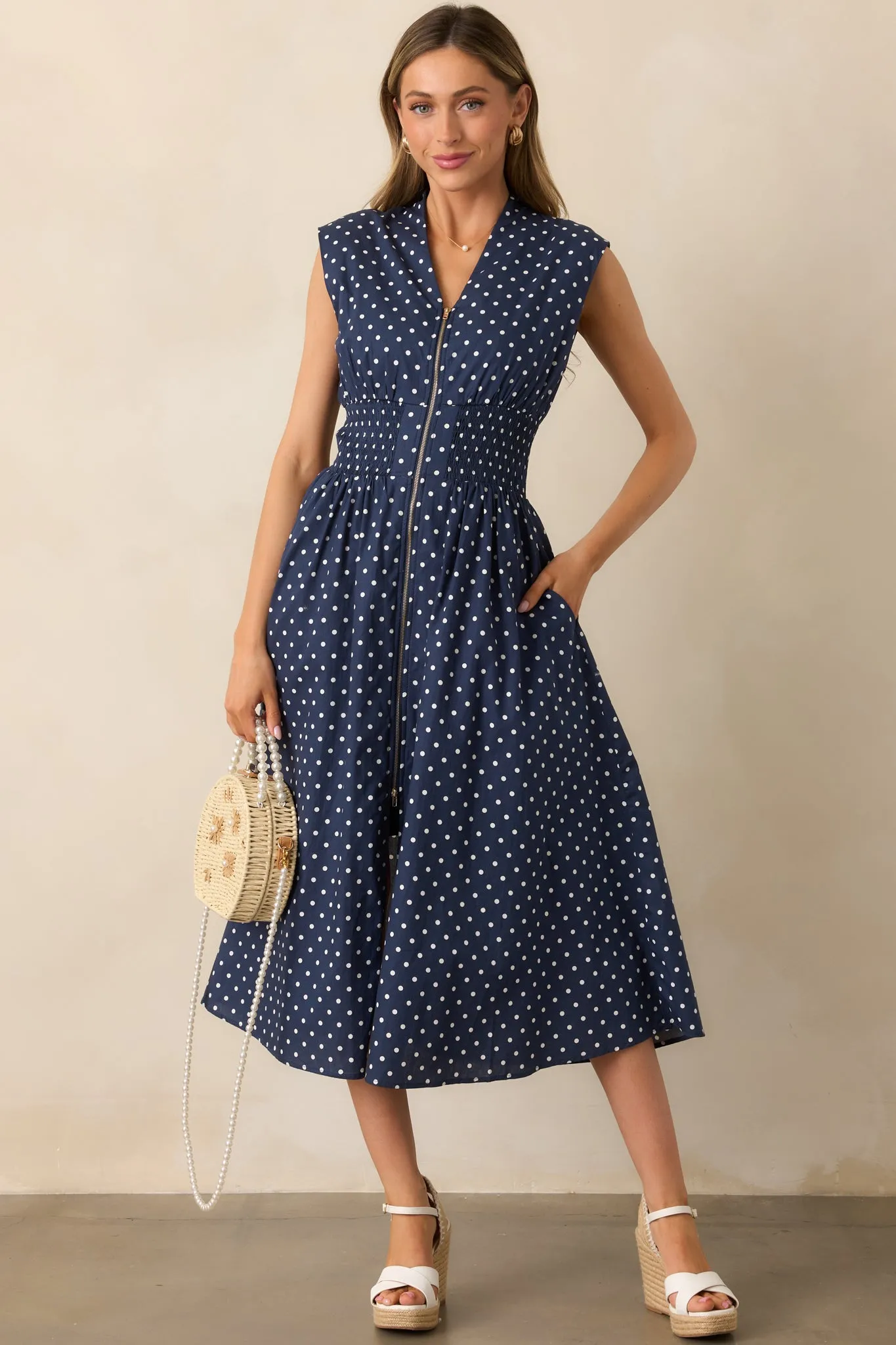 The Evette Navy Polka Dot Zip Front Midi Dress